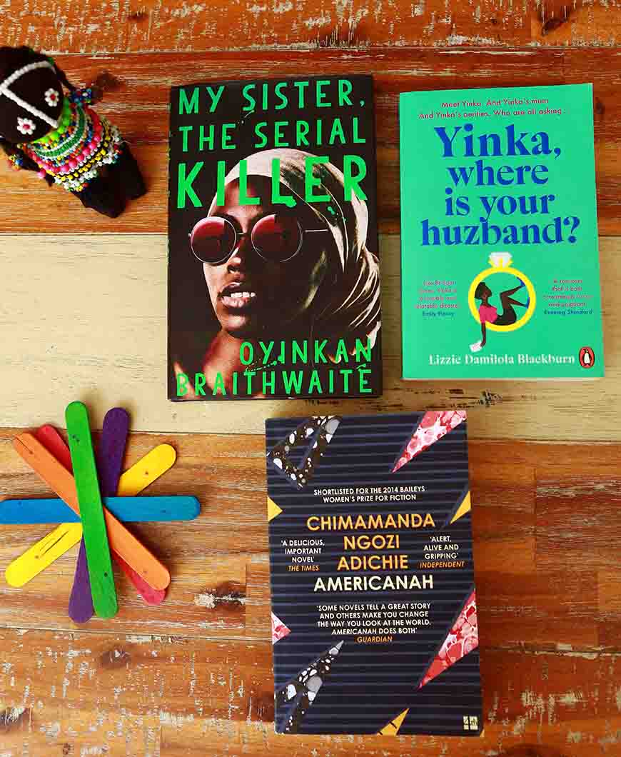 Books featuring natural hair laid out on a table