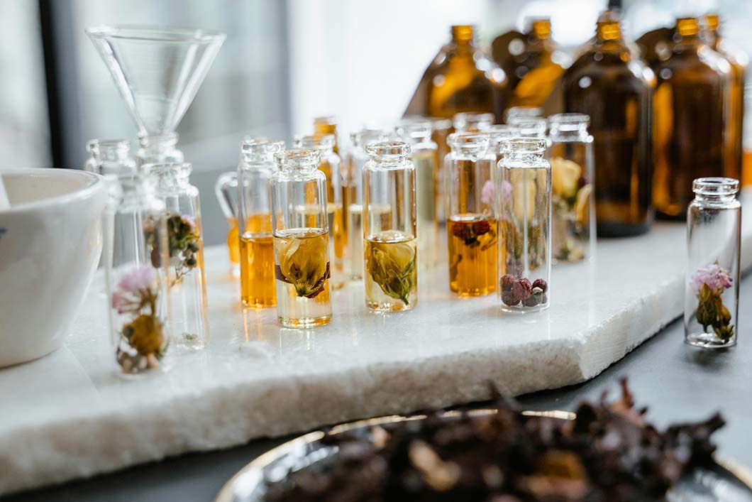 Moisturising oils lined up on a table top.