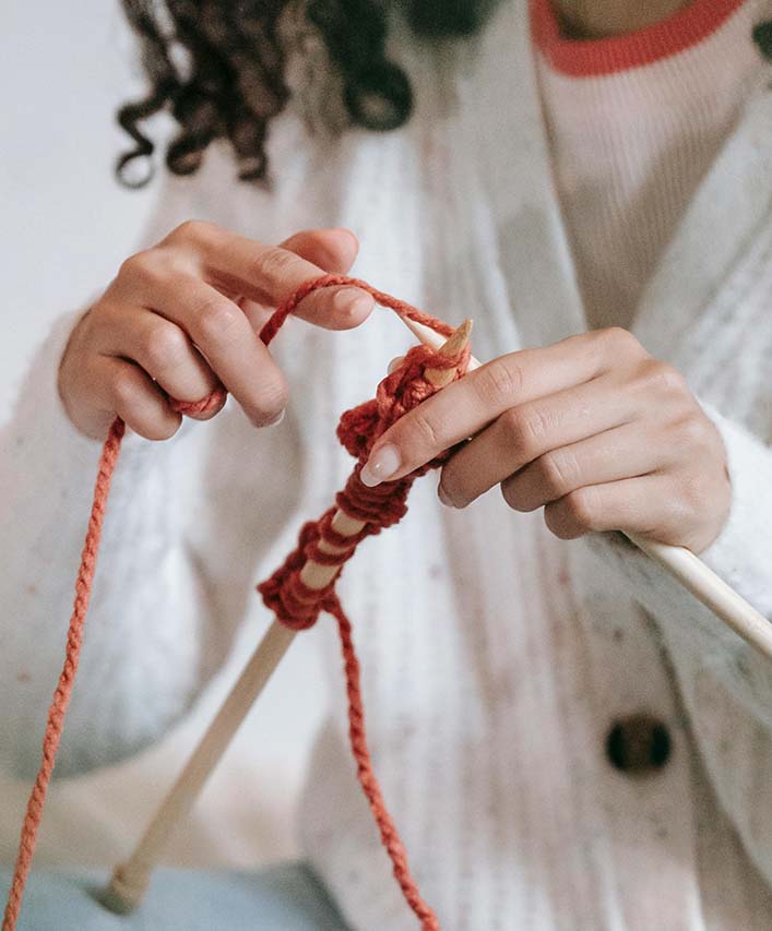 Girl knitting to show how matted hair can be detangled