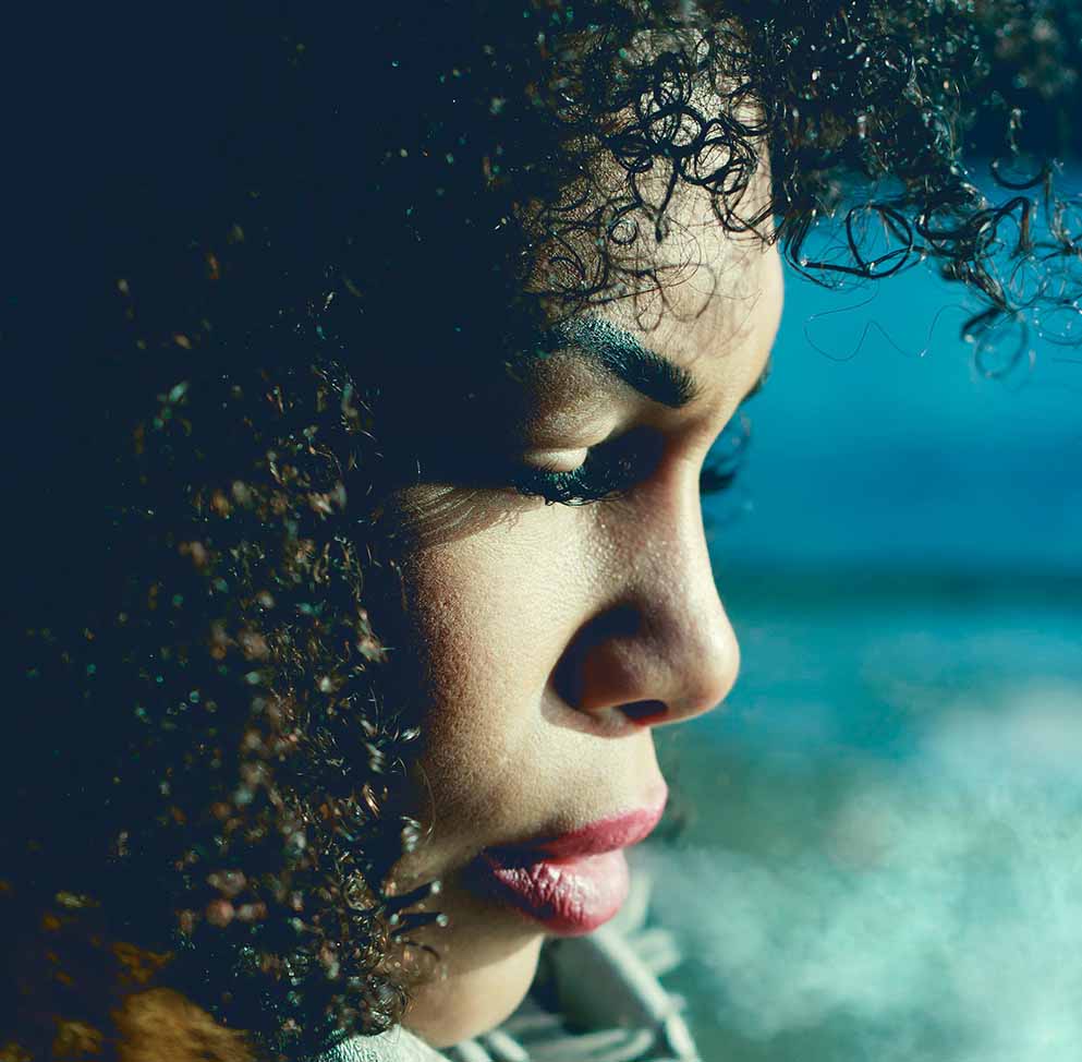 Girl with natural hair sad because of dandruff issues